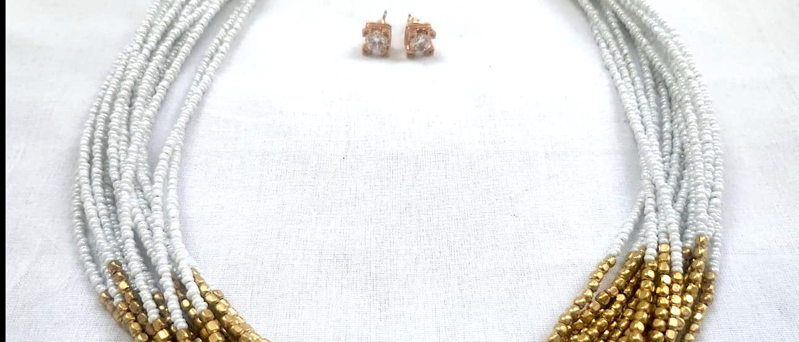 Handcrafted multi-strand beaded necklace and earrings sourced through INDUS CIRCLE