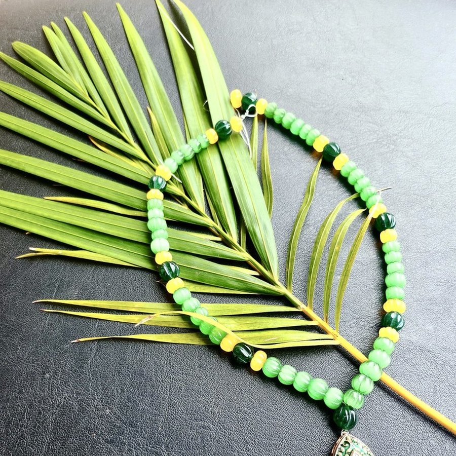 Green beaded necklace with enamel teardrop pendant, handcrafted, sourced through INDUS CIRCLE